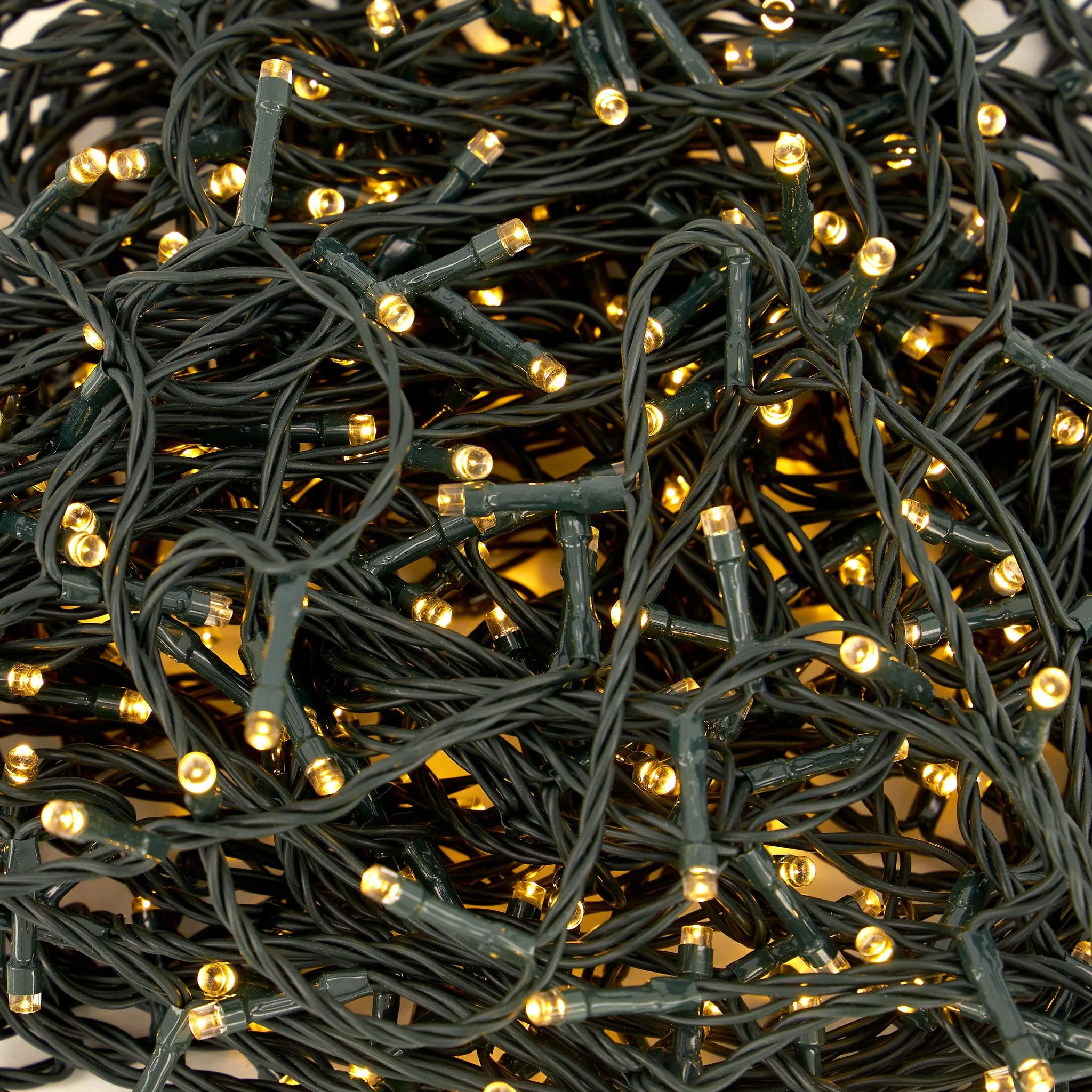 Indoor/Outdoor 8 Function LED Waterproof Fairy Lights with Green Cable (400 Lights - 32M Cable ) - Warm White Lights